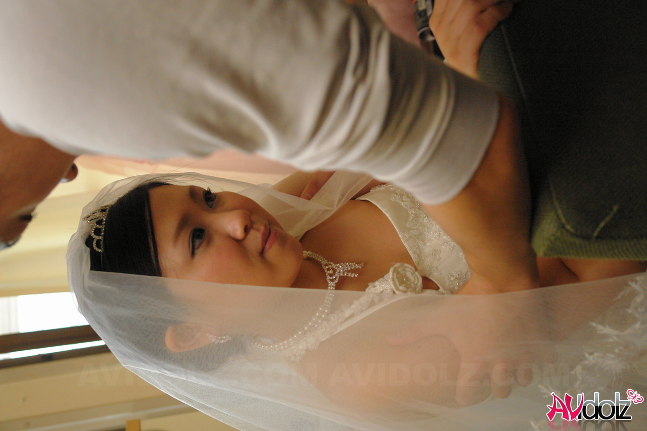 Asian newlywed Emi Koizumi gives her man a hot blowjob on their wedding day