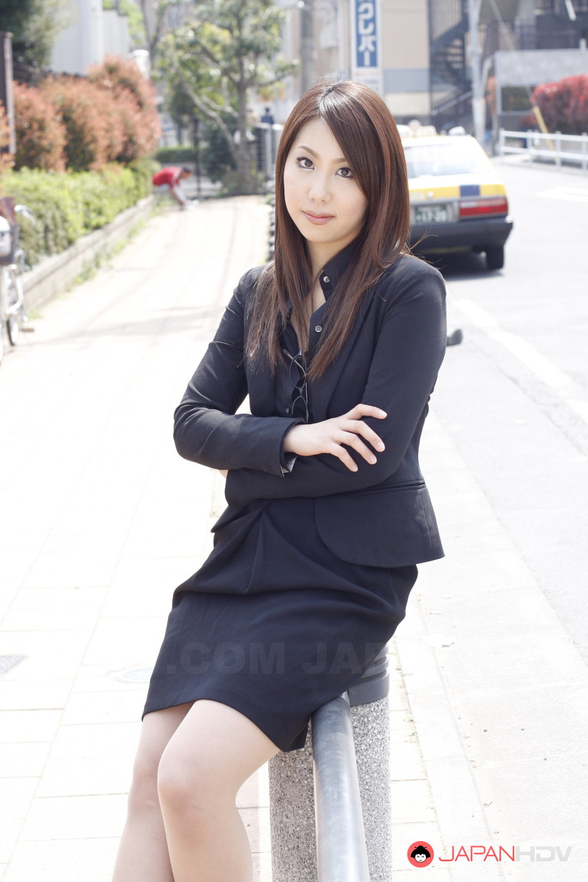 Japanese model Hikaru Matsu takes her glasses on and off in business clothing