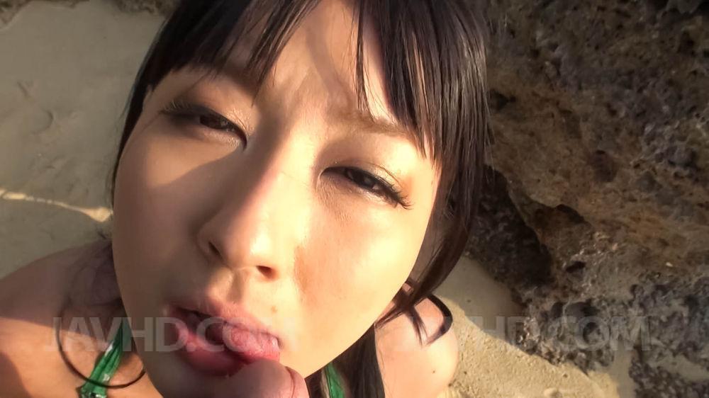 Japanese girl Megumi Haruka gives a POV blowjob on sandy ground