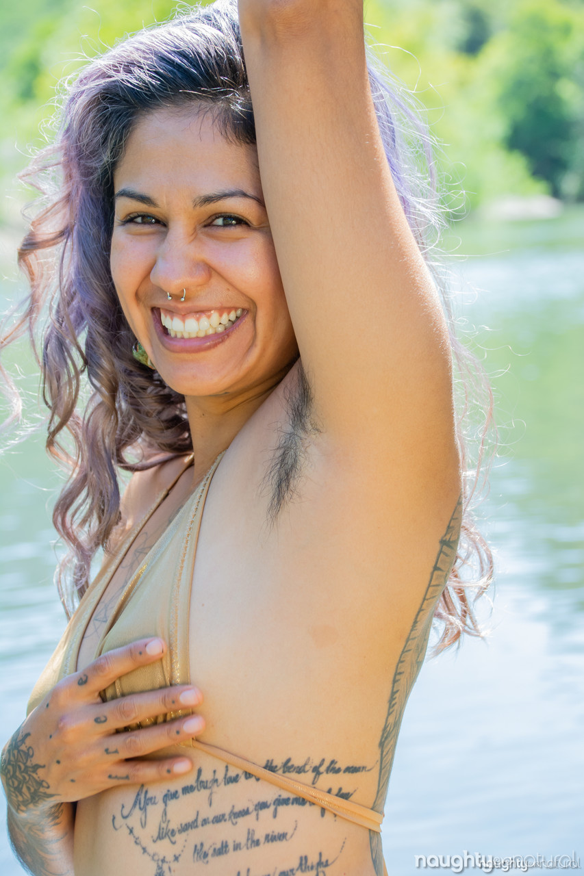Adorable amateur hottie Muxer Diosa strips in the river & shows her hairy body