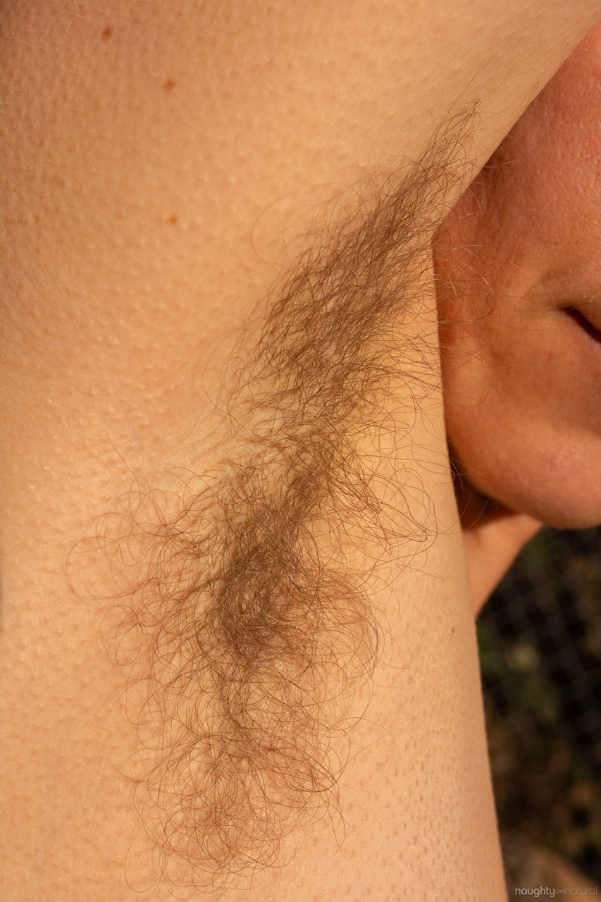 All-natural American Cookie undresses in the garden and shows her hairy body