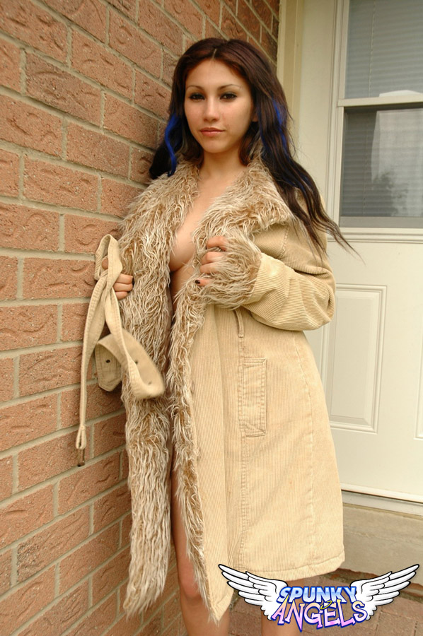 Amateur girl Angel flashes her teen ass in a fur trimmed coat outside her door