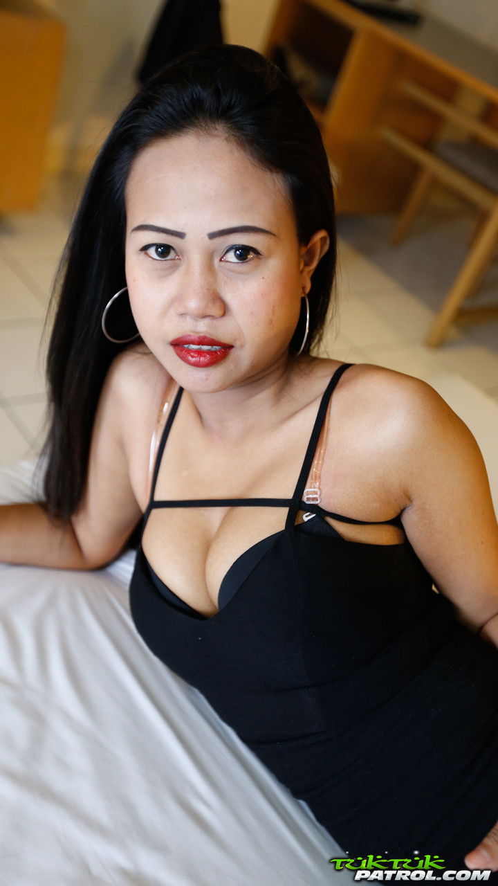 Slim Thai female removes her little black dress for her first nude poses